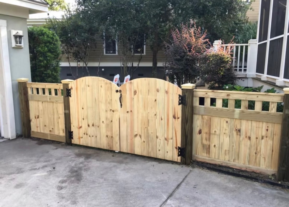 Custom arched wood gate with picket inserts, built by Low Country Custom Outdoors