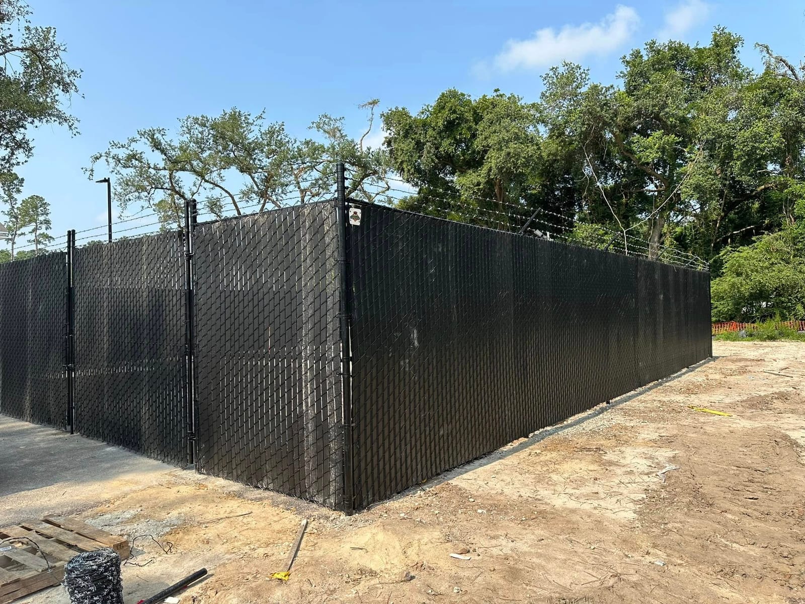 Commercial chain-link fence with privacy slats in Charleston, SC, built by Low Country Custom Outdoors
