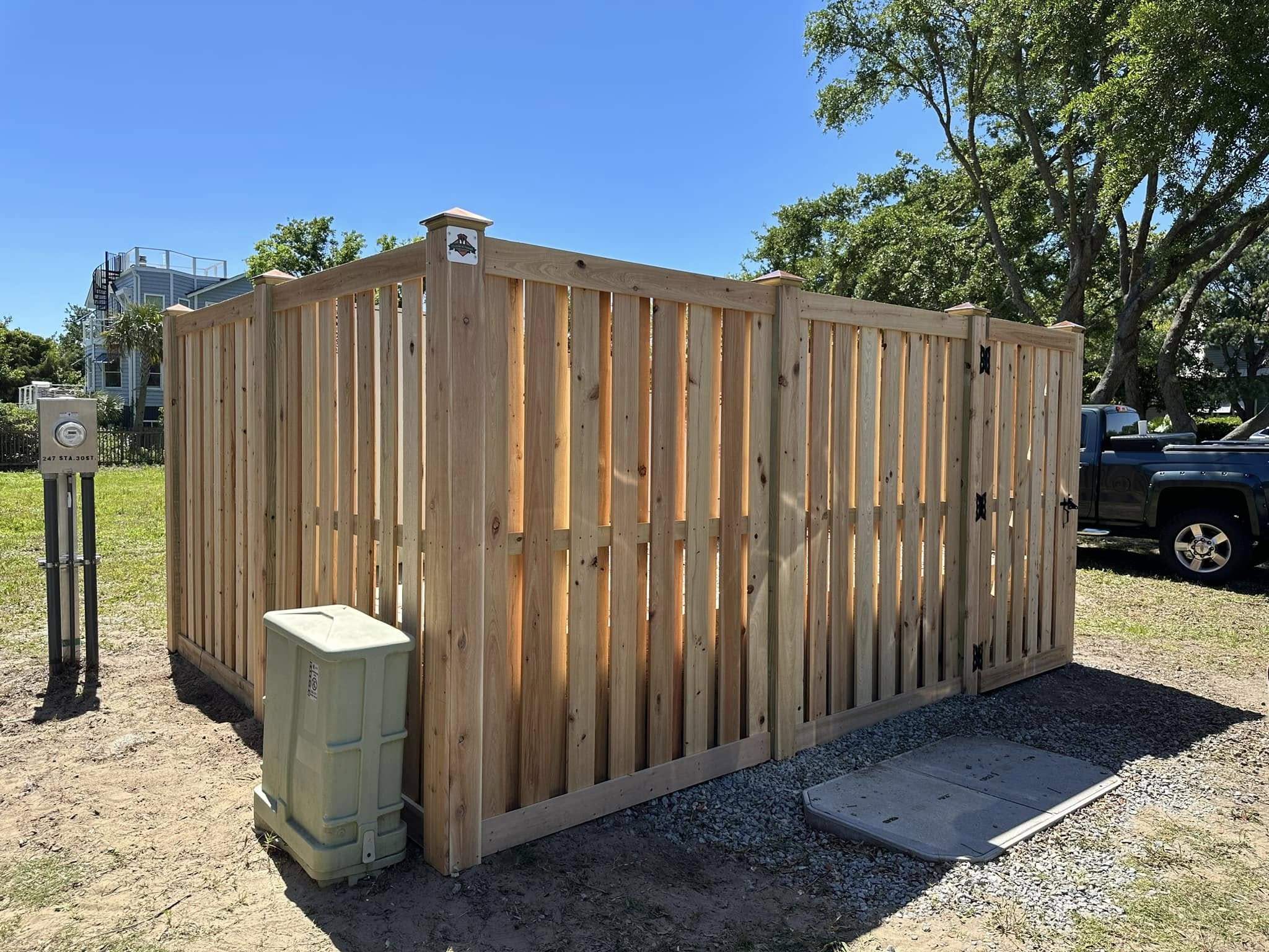 Custom wood enclosure around commercial utility equipment