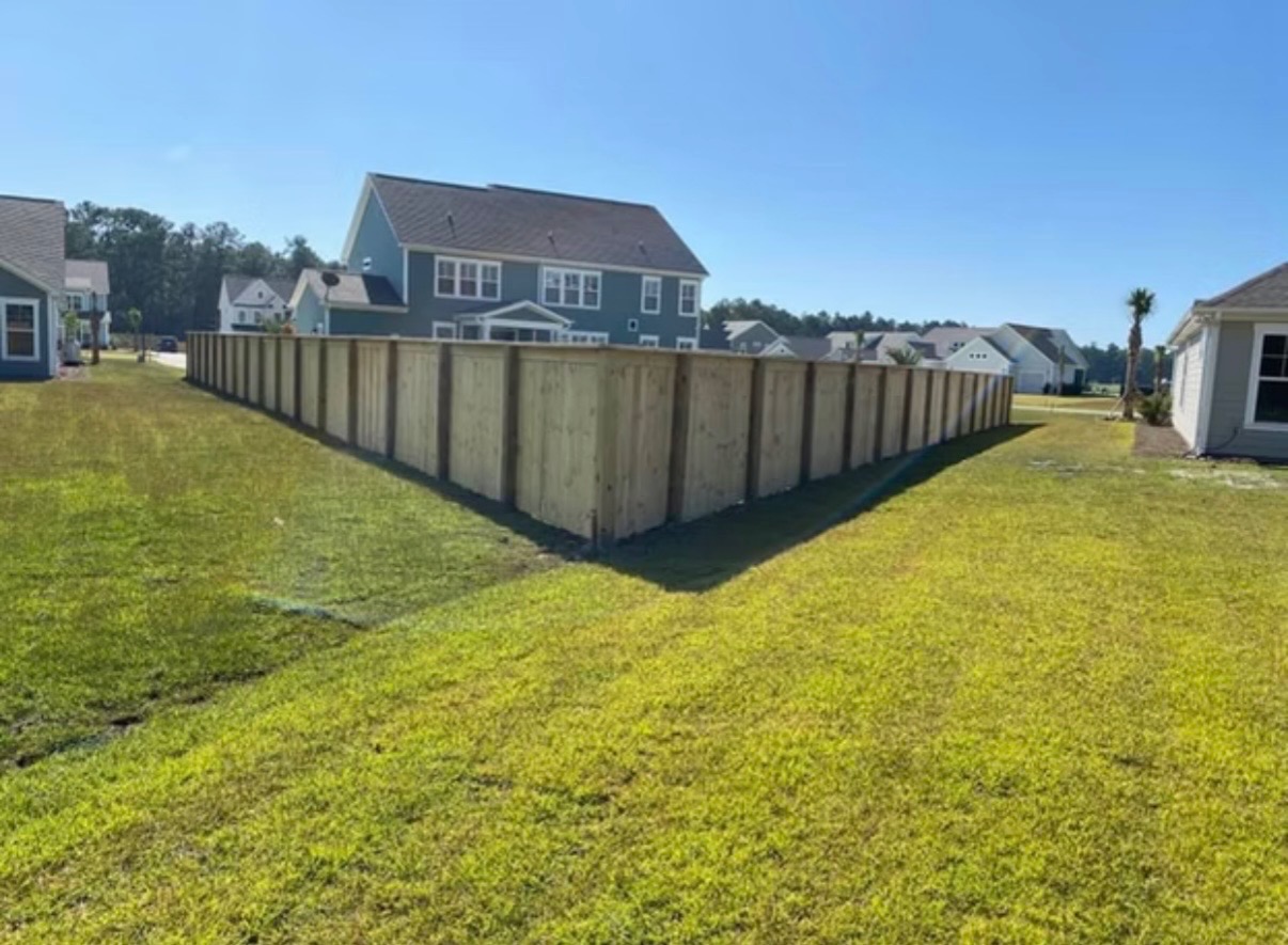Custom wood privacy fence in a Lowcountry residential backyard